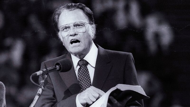 Evangelist Billy Graham preaches the Gospel  at Bercy’s Stadium in Paris in 1986. File photograph: Reuters