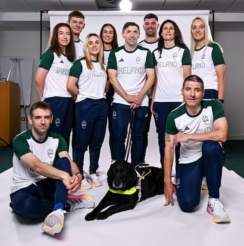 Para cyclists and pilots Mitchell McLaughlin, Eve McCrystal, Eoin Mullen, Linda Kelly, Josephine Healion, Katie-George Dunlevy, Richael Timothy, Ronan Grimes and, Damien Vereker with Juno the Dog. Photograph: Harry Murphy/Sportsfile 