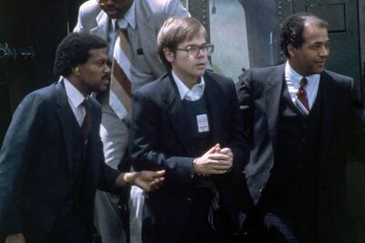 John Hinckley jnr, centre, after he attempted to assassinate US president Ronald Reagan in 1981. Photograph: Barry Thumma/AP