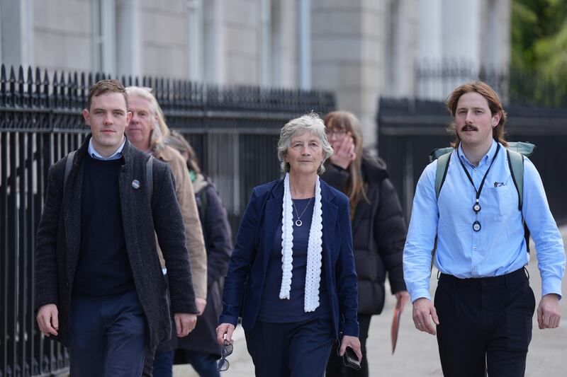 Catherine Connolly arrives at Custom House with her sons Brian (left) and Stephen to formally lodge nomination papers. Photograph: Niall Carson/PA