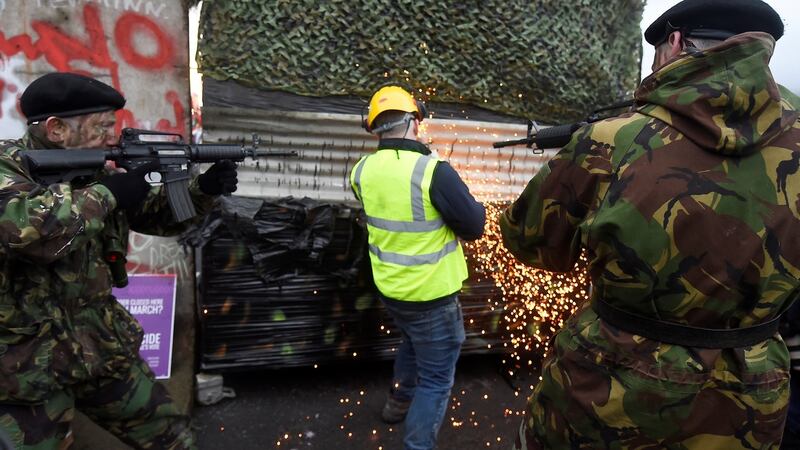 Activists destroy a mock militarised border crossing during a protest by anti-Brexit campaigners, Borders Against Brexit in Carrickcarnan, Co Louth. Photograph: Clodagh Kilcoyne/Reuters