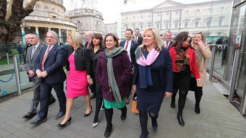 Sinn Fein Leaders Mary Lou McDonald (centre) and Michelle O’Neill (centre right) and their party colleagues leaving Leinster House on their way to the Mansion House Dublin for the centenary commemoration taking place to mark the inaugural public meeting of Dáil Eireann in 1919. Photograph: Niall Carson/PA Wire
