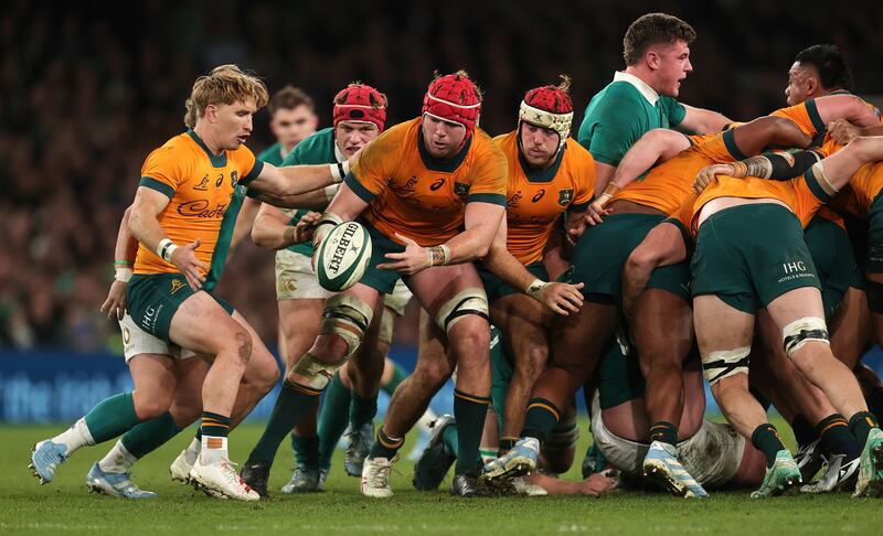 Australia's Harry Wilson offloads the ball to Tate McDermott during last year's Autumn Series match against Ireland at the Aviva Stadium. Photograph: David Rogers/Getty Images