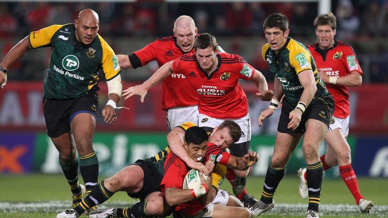 Munster’s Lifeimi Mafi is tackled by Northampton’s Dylan Hartley during the Heineken Cup game at Thomond Park in 2011. Photograph: Billy Stickland/Inpho