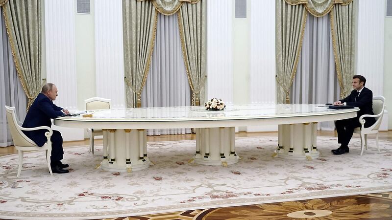 French president Emmanuel Macron  with Russian president Vladimir Putin: The now-famous long table  was claimed by Renato Pologna as the work of his northern Italian furniture company Oak.  Photograph: Sputnik/AFP via Gett