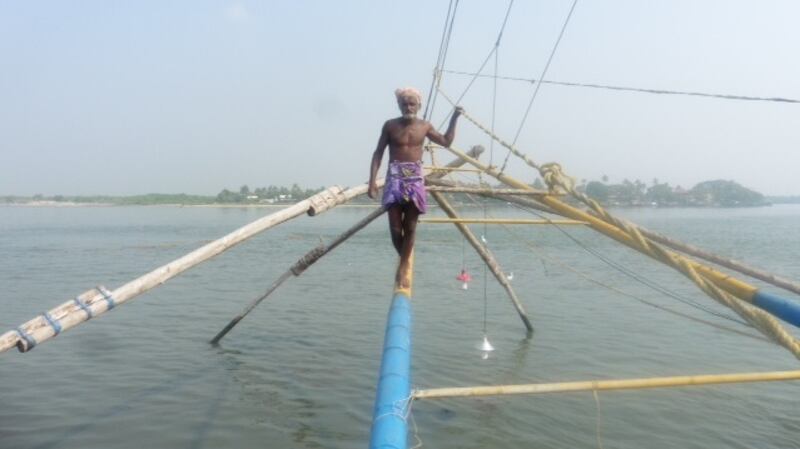 Day 218: Fisherman operating Chinese fishing nets at Fort Kochi in Kerela, India.