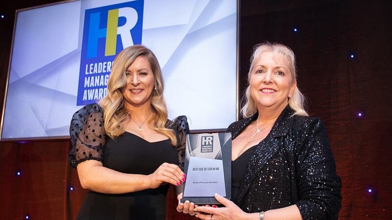 Sinead Joyce, marketing manager, DeCare Dental, presents the Best Use of CSR in HR award to Julie Sharp, Brown Thomas Arnotts.