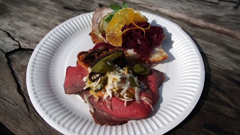Smørrebrød (Danish open sandwiches) with roast pork,  red cabbage and orange, and rare roast beef with pickles, cheese and fried onion.