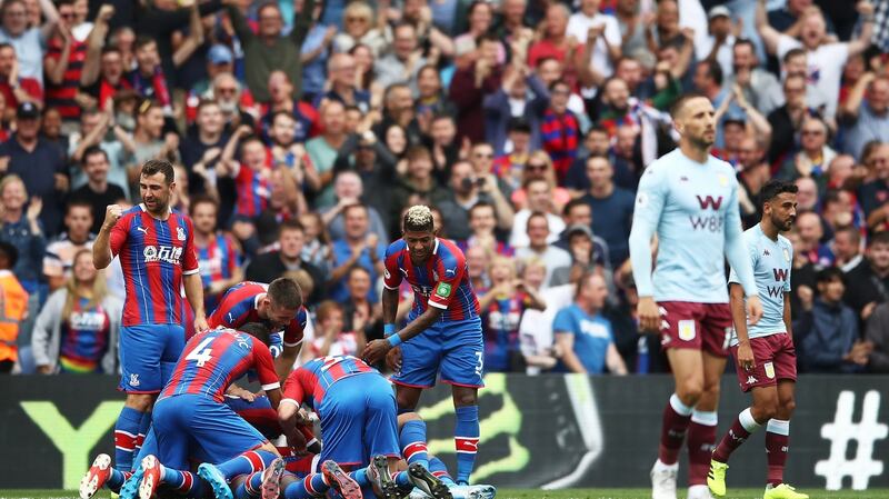 Crystal Palace celebrate Jordan Ayew’s late winner against Aston Villa. Photograph: Bryn Lennon/Getty
