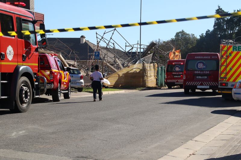 Emergency services try to locate construction workers trapped after a five-storey building collapsed in George, South Africa, on Monday. Photograph: Kirsty Kolberg/EPA-EFE
