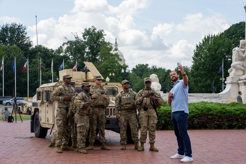 Members of the National Guard pose for a selfie outside Union Station in Washington, DC. Photograph: Andrew Leyden/Getty 