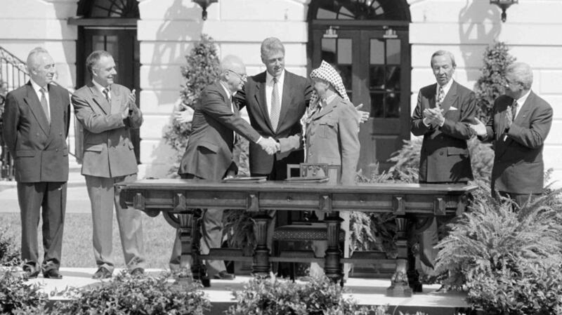Shimon Peres: Born: August 1st, 1923Died: September 28th, 2016 – Peres, left, during the signing ceremony for the Oslo Accords with Israeli prime minister Yitzhak Rabin and Yasser Arafat on the South Lawn of the White House in Washington in  1993. From left: Peres, Russian foreign minister Andrei Kozyrev, Rabin, US president Bill Clinton, Aarafat, secretary of state Warren Christopher and PLO chief negotiator Mahmoud Abbas. Photograph:  Paul Hosefros/The New York Times