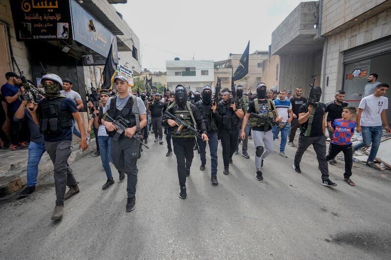 Armed Palestinians march during the funeral of Mahmoud Al-Sous, in the West Bank town of Jenin on Saturday. Photograph: Majdi Mohammed/AP/PA
