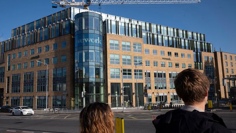 People walk by WeWork offices in Dublin. Photograph: AP Photo/Mark Lennihan
