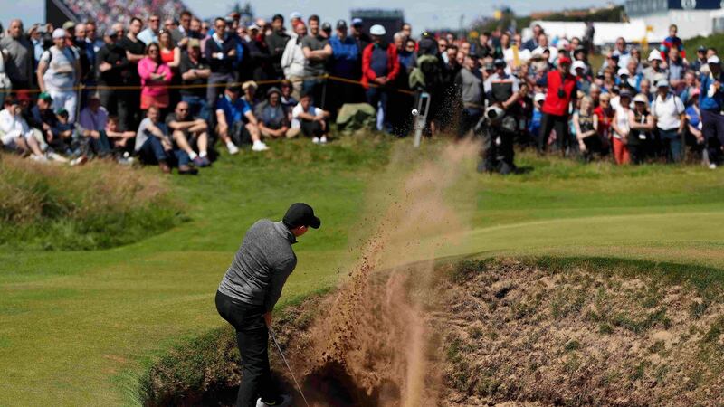 Northern Ireland’s Rory McIlroy plays out of a bunker on the 14th hole during the first round of the British Open at Royal Troon. Photo: Paul Childs/Reuters