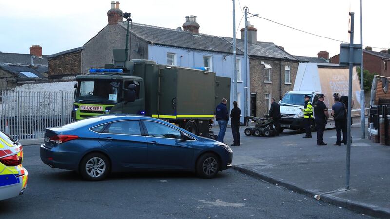 Armed gardaí and members of the Army Explosive Ordnance Disposal team at the scene where two men were arrested on Spring Garden Street, Dublin, on Friday night. Photograph:  Colin Keegan/Collins Dublin