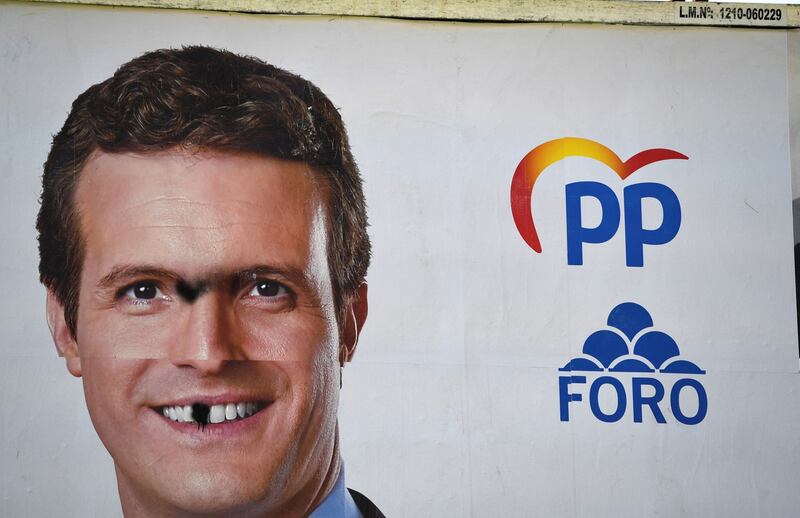 A defaced poster of the Popular Party (PP) candidate, Pablo Casado, is seen a day after the general elections, in Oviedo, Spain on Monday. Photograph: Eloy Alonso/Reuters