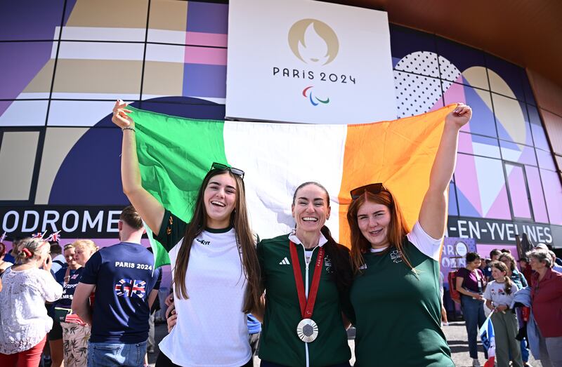 Eve McCrystal celebrates with daughters Ava and Nessa after winning silver in the women's B 3000m final at the Paralympic Games in Paris. Photograph: Harry Murphy/Sportsfile 
