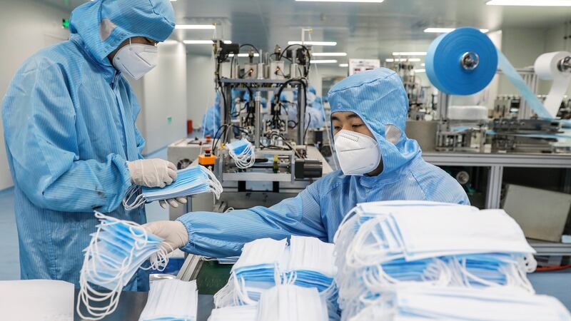 Face masks are produced at a factory of the Naton Technology Group in Beijing. Photograph: Wu Hong/EPA
