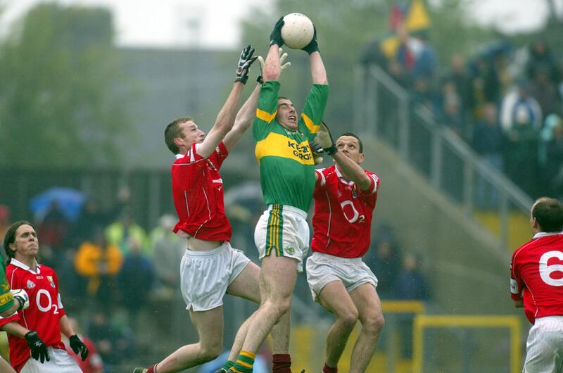High fielding: Dara Ó'Sé of Kerry beats Nicholas Murphy and Michael O'Sullivan of Cork to the ball during the Munster semi-final against Cork in June of 2002. File photograph: Inpho