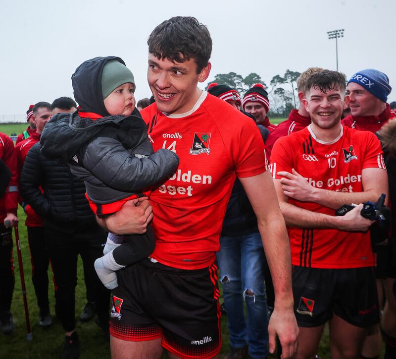 At the Fossa vs Kilmurry Munster junior final David Clifford holds his son, Óigí, in the crook of his arm. 

