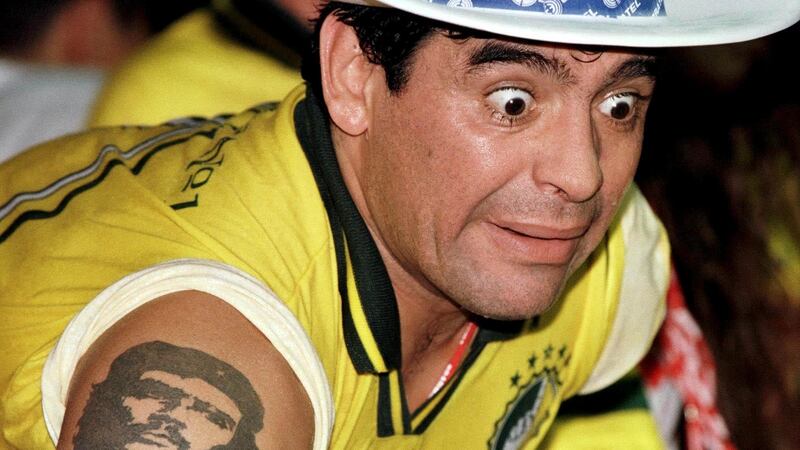 Diego Maradona watching a Carnival parade at the Sambadrome in Rio de Janeiro in 1998. Photo: Gregg Newton/Reuters