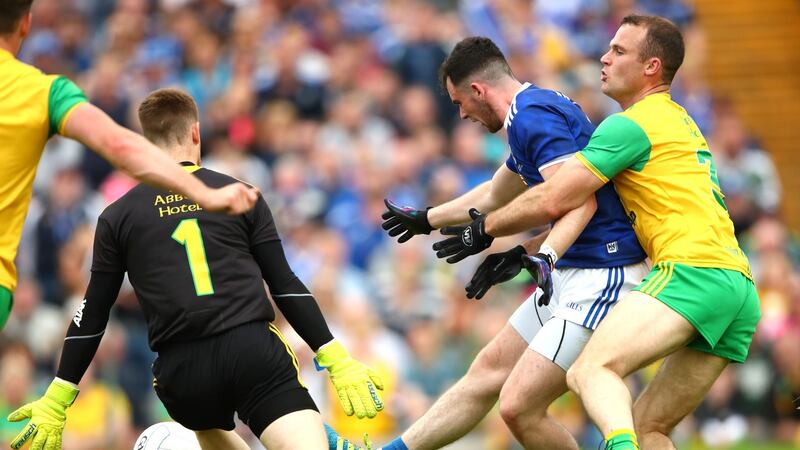 Cavan’s Conor Rehill shoots wide while under pressure from goalkeeper Shaun Patton and Neil McGee of Donegal during the Ulster final at Clones. Photograph: James Crombie/Inpho