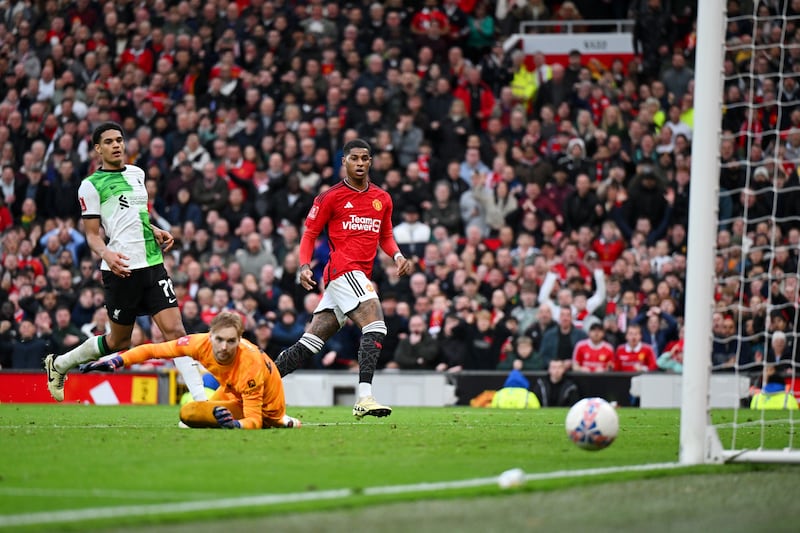 Marcus Rashford of Manchester United shoots and misses as Caoimhin Kelleher of Liverpool looks on. Photograph: Michael Regan/Getty