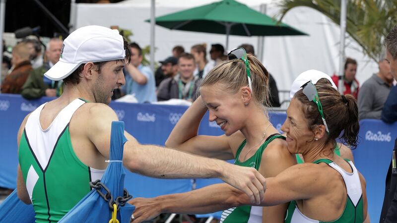 Ireland’s Paul O’Donovan is congratulated by Claire Lambe and Sinead Lynch after the race. Photo: Morgan Treacy/Inpho