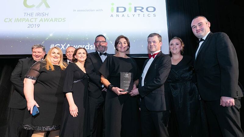 Aidan Connolly, CEO, Idiro Analytics presents the CX Impact in Utilities award to the Gas Networks Ireland team.