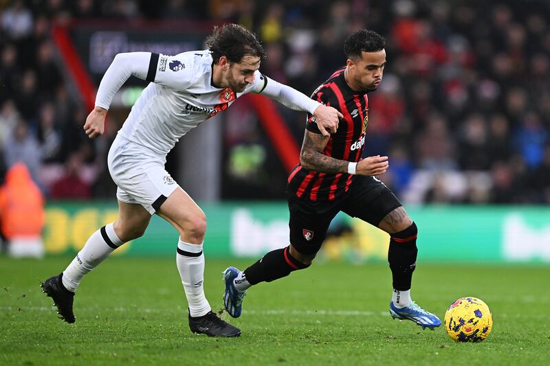 Tom Lockyer in action for Luton Town against Bournemouth's Justin Kluivert during the Premier League game at Vitality Stadium. Photograph: Mike Hewitt/Getty Images