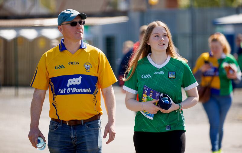 Fans arrive for the game in Ennis between Clare and Limerick. Photograph: James Crombie/Inpho
