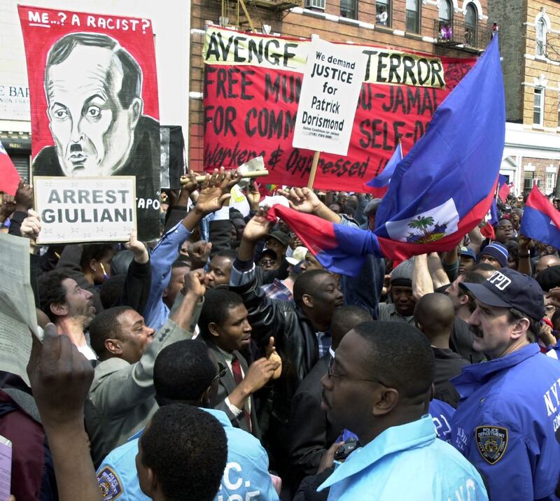 Protesters confront NYPD officers outside the funeral of Patrick Dorismond in March 2000. Photograph: Henny Ray Abrams/AFP via Getty