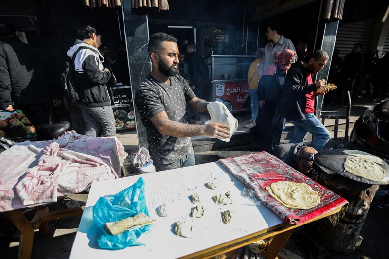 People make bread at the popular market in Rafah, Gaza, this week. Photograph: Ahmad Hasaballah/Getty 