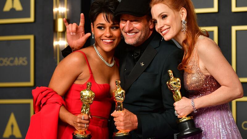 Best actor in a supporting role Troy Kotsur (centre), best actress in a supporting role Ariana DeBose (left) and best actress in a leading role Jessica Chastain (right). Photograph: Frederic J Brown/AFP via Getty Images