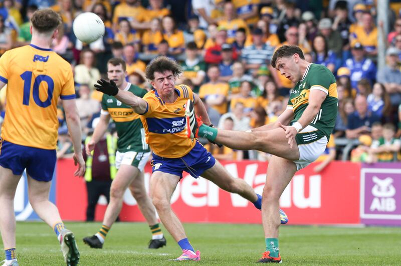 Kerry's David Clifford is challenged by Clare's Manus Doherty during Munster Football Championship Final. Photograph: Tom Maher/Inpho
