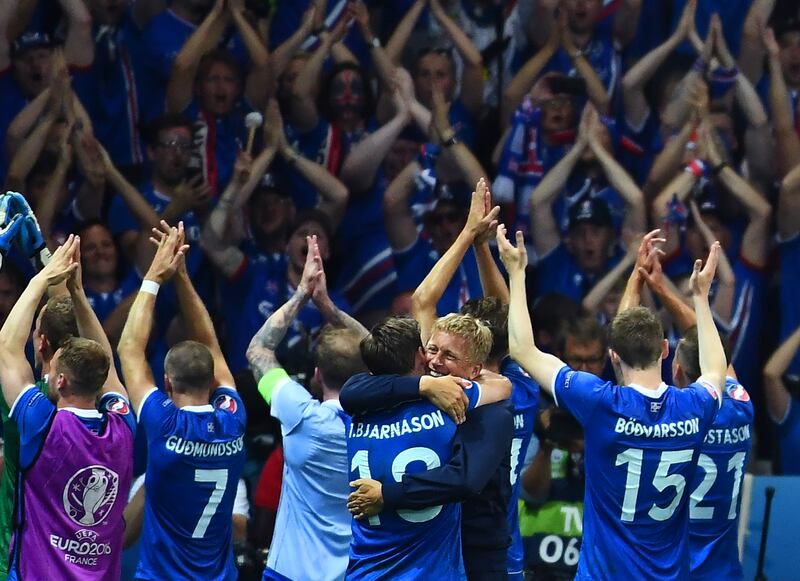 Iceland's coach Heimir Hallgrímsson and his players celebrate after the Euro 2016 game against England. Photograph: Anne-Christine Poujoulat/AFP via Getty Images