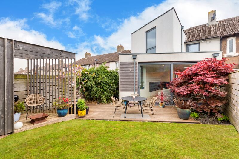 Back garden and view of rear extension