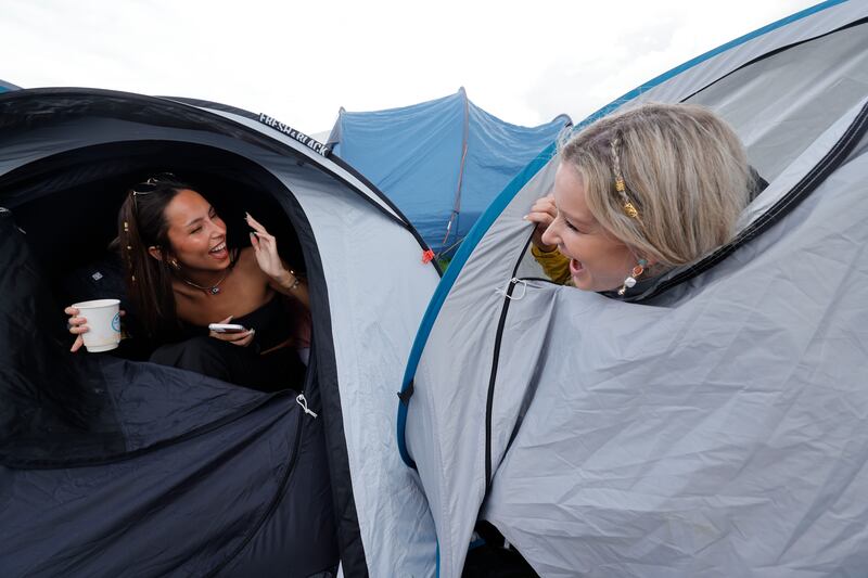 Ellen Mullins and Séafra Monks from Dún Laoghaire, Co Dublin, at their campsite on Friday. Photograph: Alan Betson/The Irish Times

