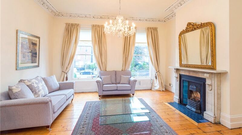 The two grandly proportioned interconnecting reception rooms are the most appealing feature of number 55