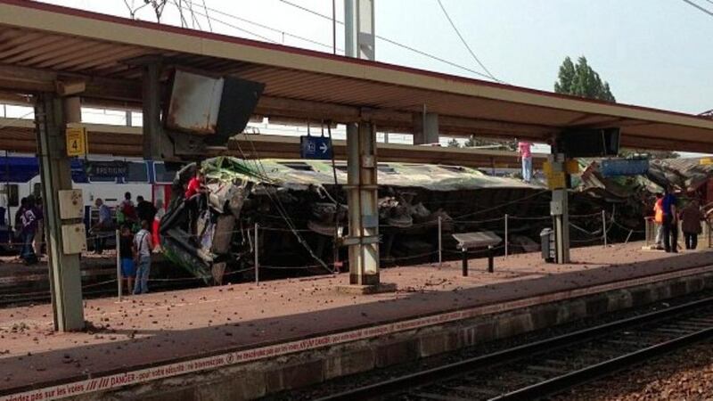The train veered off the track en route from Paris to the city of Limoges at the station of Bretigny-sur-Oise, leaving several carriages torn and one lying on its side. Photograph: Handout via Reuters