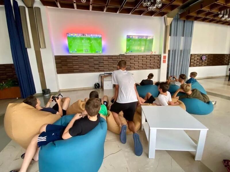 The players fill their ample downtime by playing card games and taking turns on two video game consoles recently donated to the group by the Red Cross. Photograph: Shakhtar Donetsk