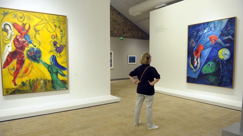 ‘I love Chagall – his imagination is so free and has no rules.’ Above, a  visitor looks at paintings by  Marc Chagall entitled The Dance, left, and The Blue Circus, right, during an exhibition in Landerneau, western  France. Photograph:  Fred Tanneau/AFP/Getty Images