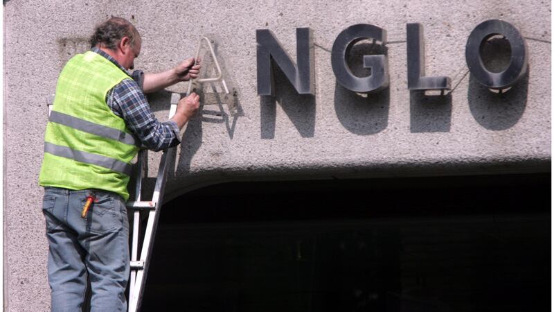 Ken Glennon of Wayfinding removes the Anglo Irish Bank signage and lettering from the Anglo Irish Bank headquarters in St Stephen’s Green Dublin  in April 2011. Photograph: Bryan O’Brien/The Irish Times
