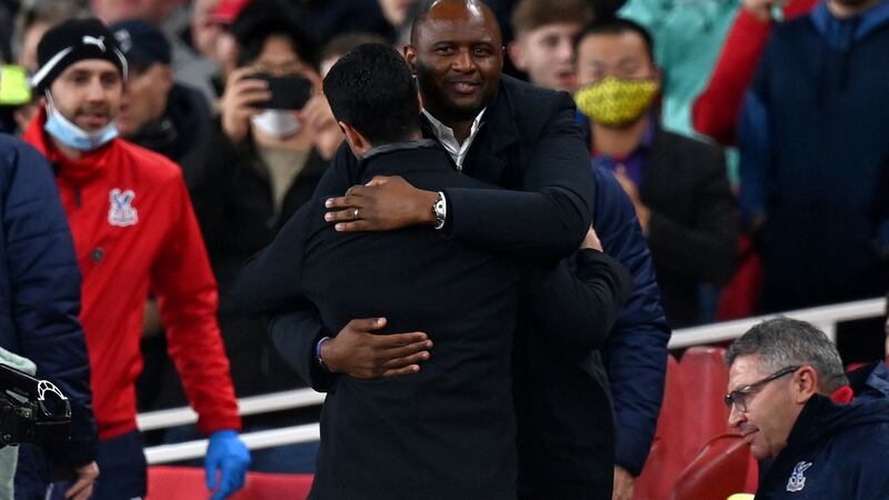 Patrick Vieira embraces Mikel Arteta before the match. Photo: Glyn Kirk/AFP via Getty Images