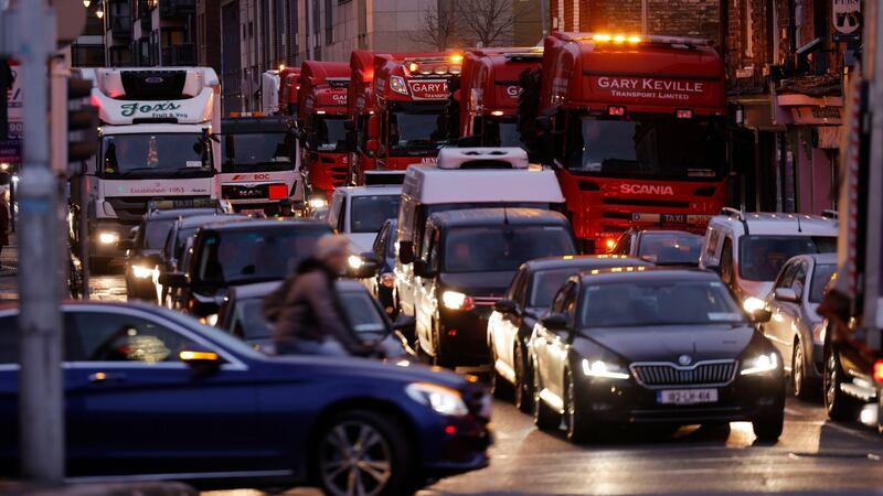 7:56am. City-bound trucks at Queen Street before joining traffic on Dublin’s quays taking part in a protest against fuel prices. Photograph: Alan Betson / The Irish Times