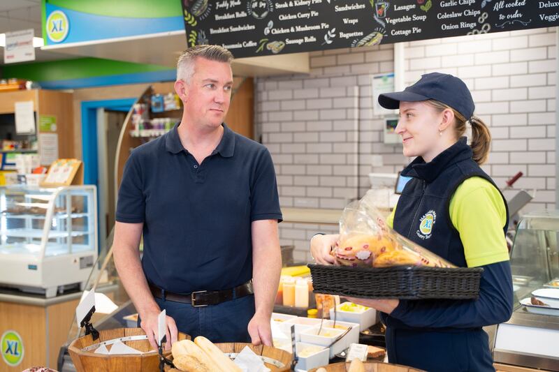 At the deli counter with his niece and shop assistant Edel Griffin