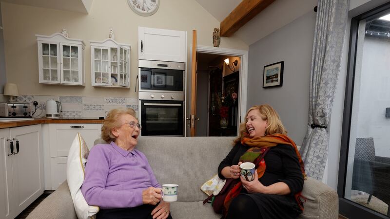 Tess Cuffe with her daughter Moira in Tess’s renovated portion of the shared cottage. Photograph: Alan Betson