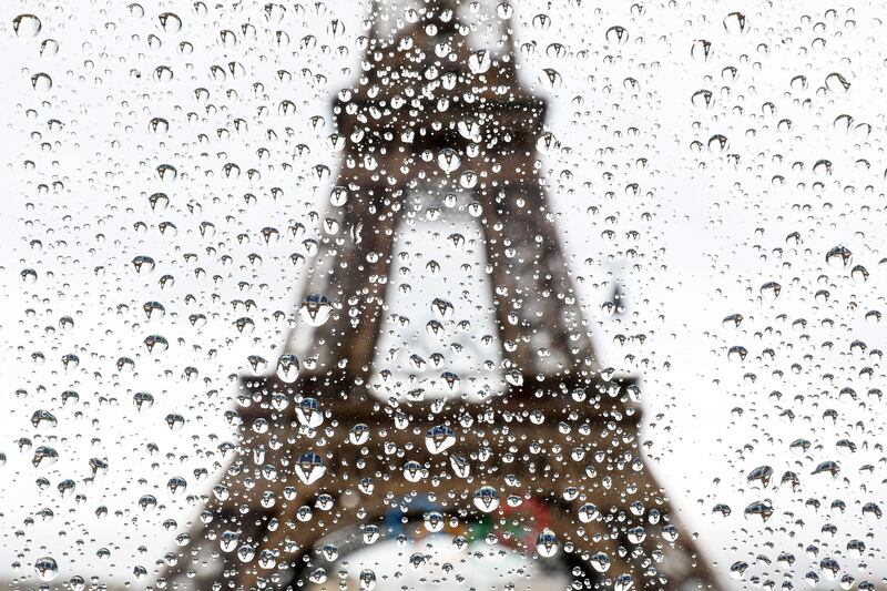 Rain drops reflect the Eiffel Tower at the beach volleyball venue Champ de Mars ahead of the Paris 2024 Olympic Games. Photograph: Steph Chambers/Getty Images