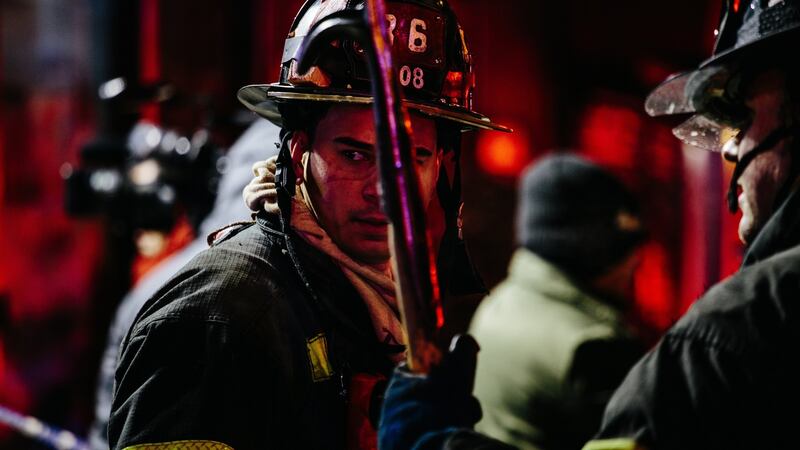 Firefighters at the scene. Photograph: Alba Vigaray/EPA